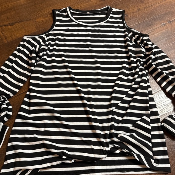 Tops - A black and white striped cold-shoulder top with long sleeves